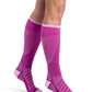 Woman wearing Sigvaris Motion Flow Tech compression socks in the color Orchid