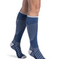 Woman wearing Sigvaris Motion Flow Tech compression socks in the color Deep Sea