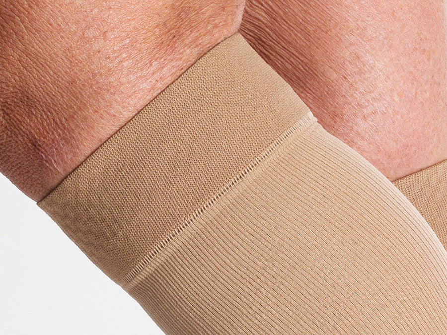 Closeup detail image of the grip-top band on Sigvaris Essential Cotton compression knee-highs