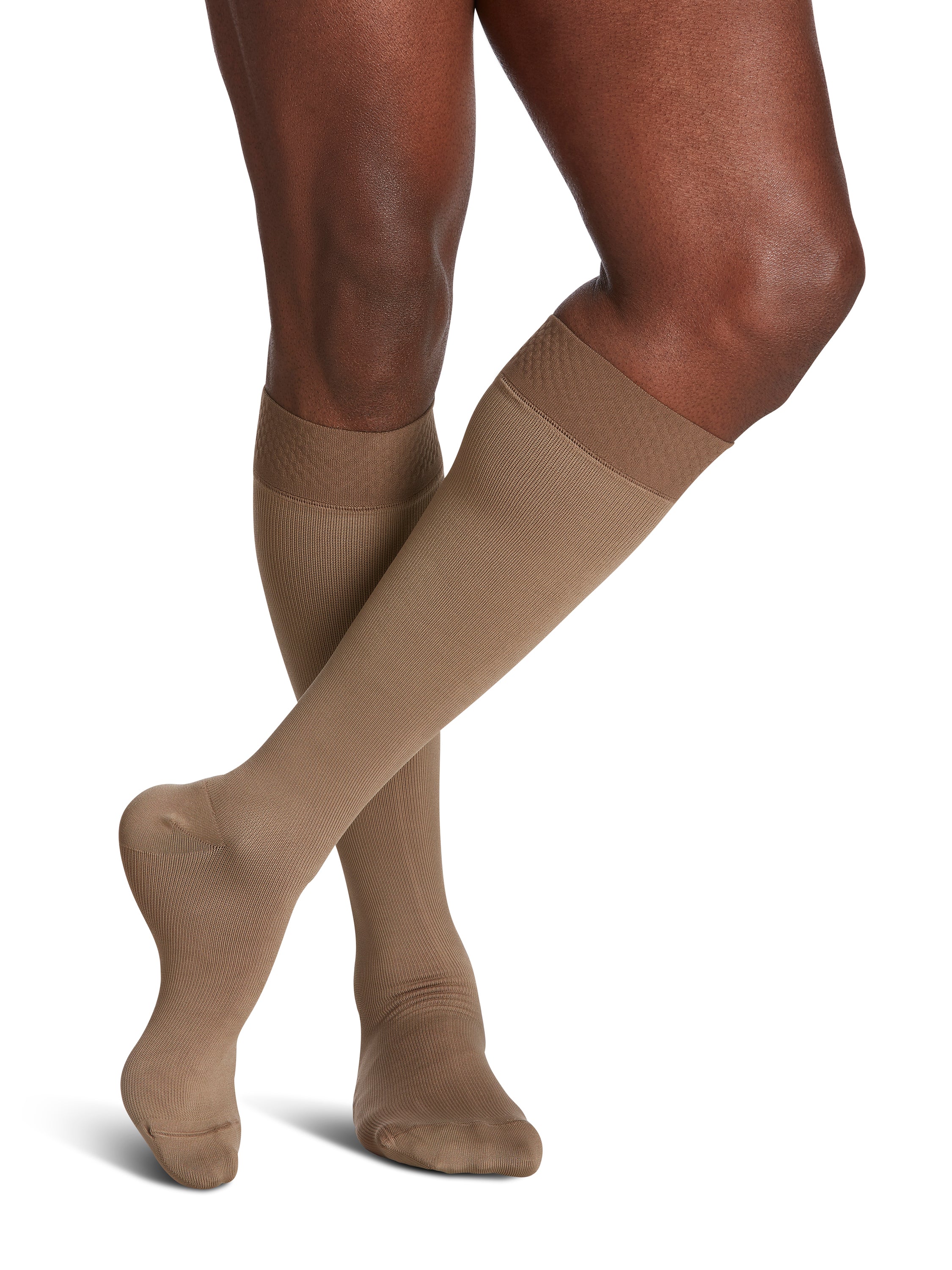 Man wearing Sigvaris Style Microfiber compression socks with grip-top in the color Tan Khaki