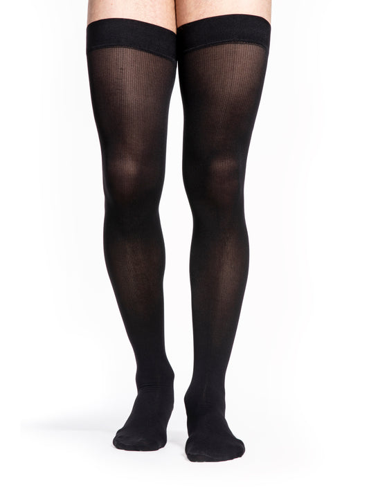 Man wearing Sigvaris Style Microfiber compression thigh-highs in the color Black