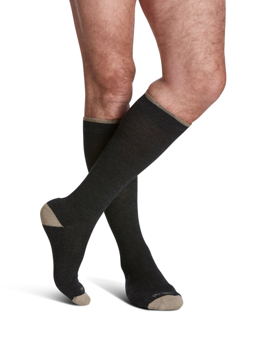 Man wearing SIGVARIS GROUP Merino Outdoor compression socks in the color Charcoal