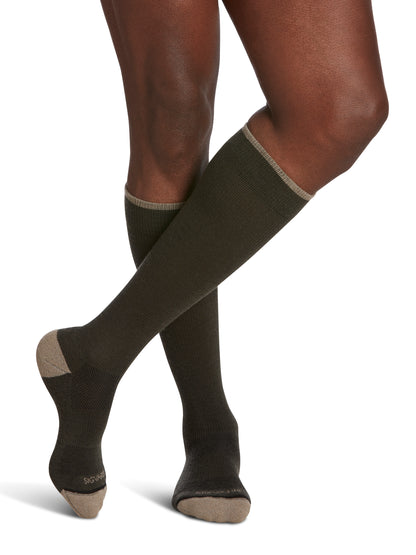 Man wearing SIGVARIS GROUP Merino Outdoor compression socks in the color Olive