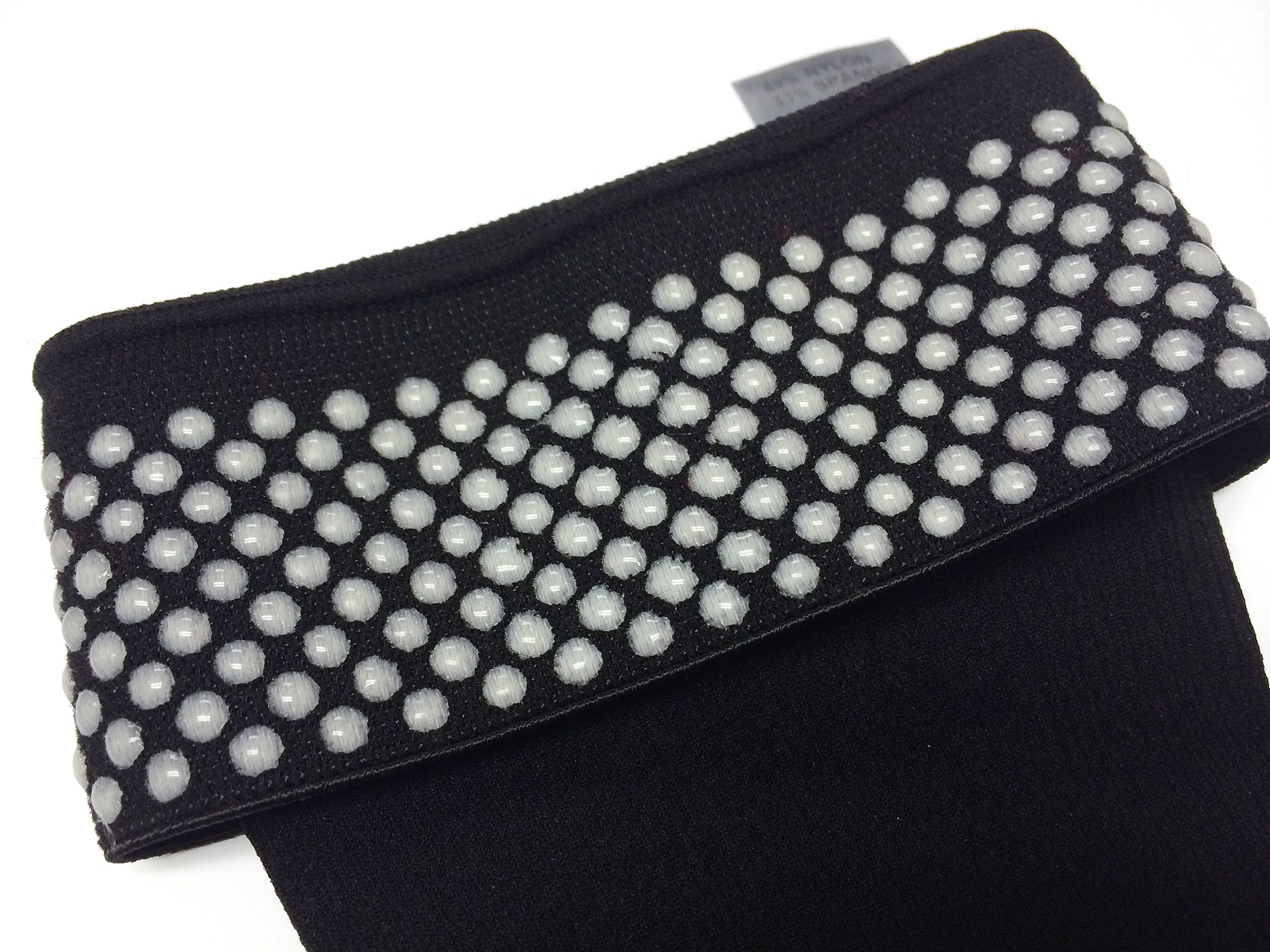 Closeup detail image of grip-top band on Sigvaris Style Microfiber compression socks