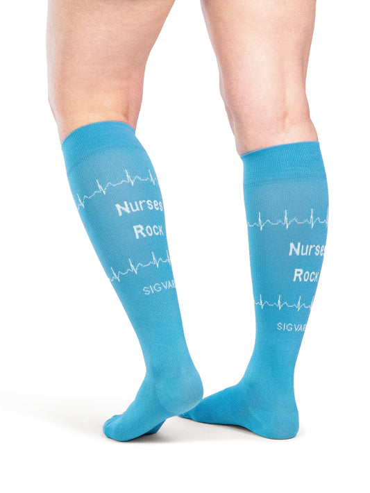 Back view of a woman wearing SIGVARIS GROUP Microfiber Shades compression socks in the color Nurse Blue