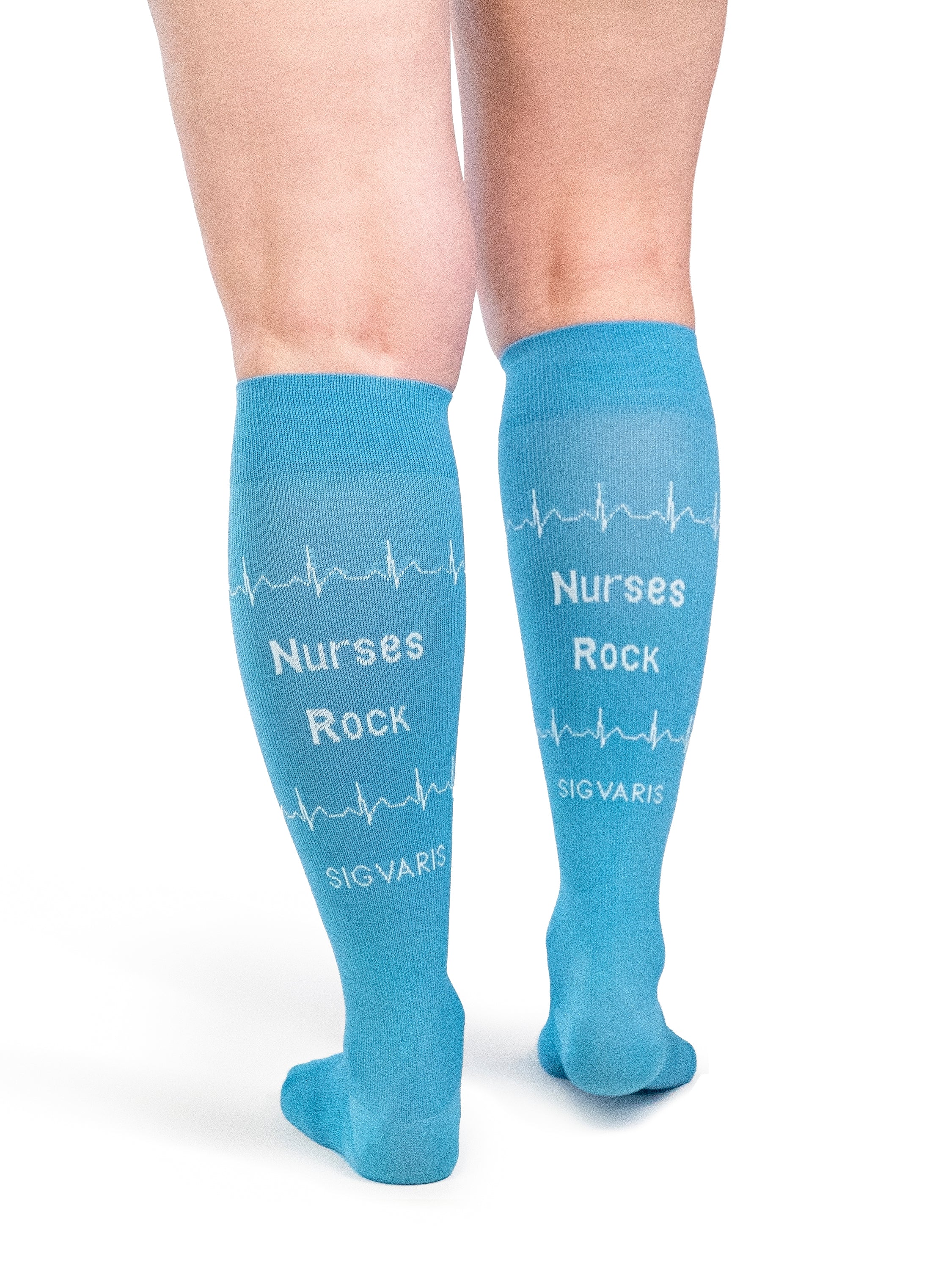 Back view of a woman wearing SIGVARIS GROUP Microfiber Shades compression socks in the color Nurse Blue