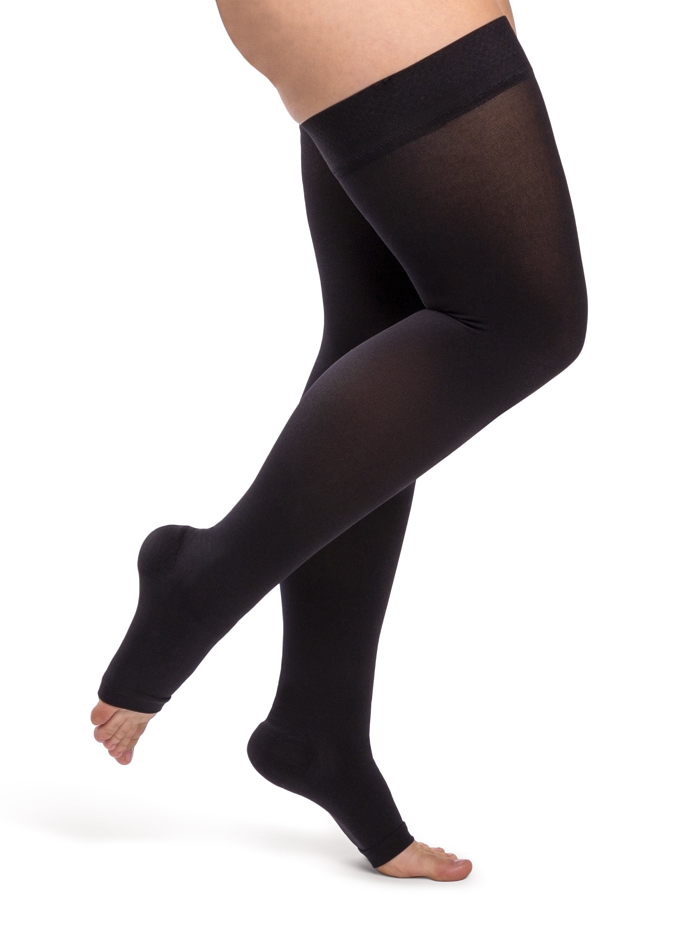 Woman wearing Sigvaris Essential Opaque open-toe compression thigh-highs in the color Black