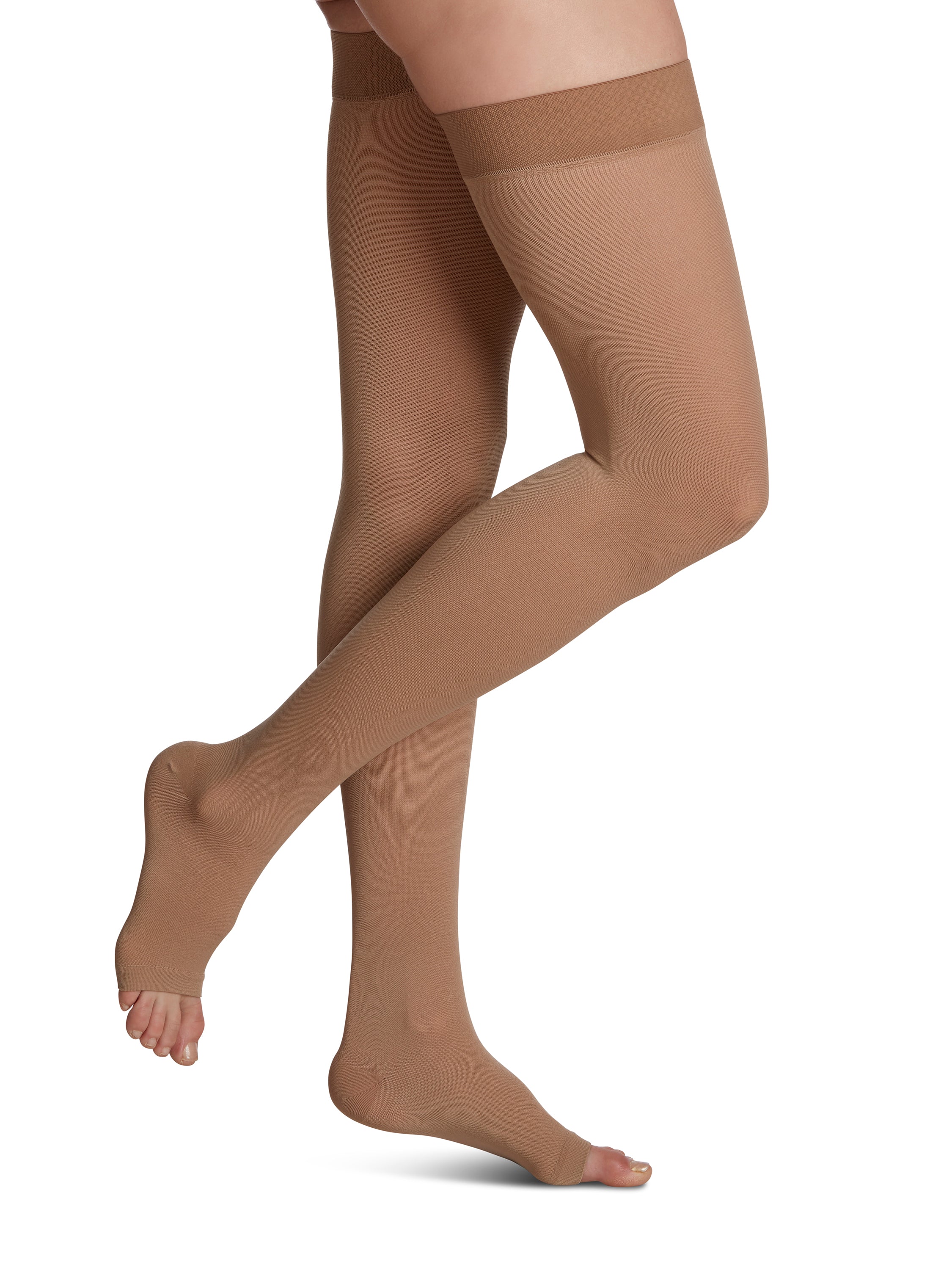 Woman wearing Sigvaris Essential Opaque open-toe compression thigh-highs in the color Light Beige