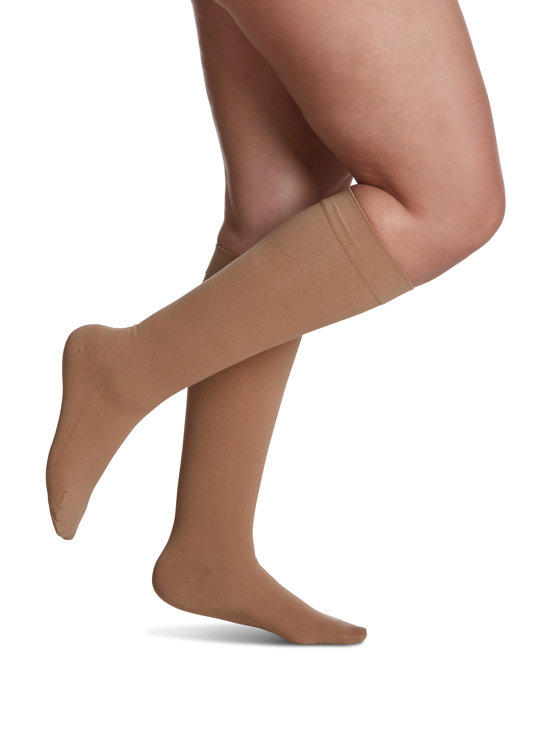 Woman wearing Sigvaris Essential Cotton compression calf in the color Light Beige
