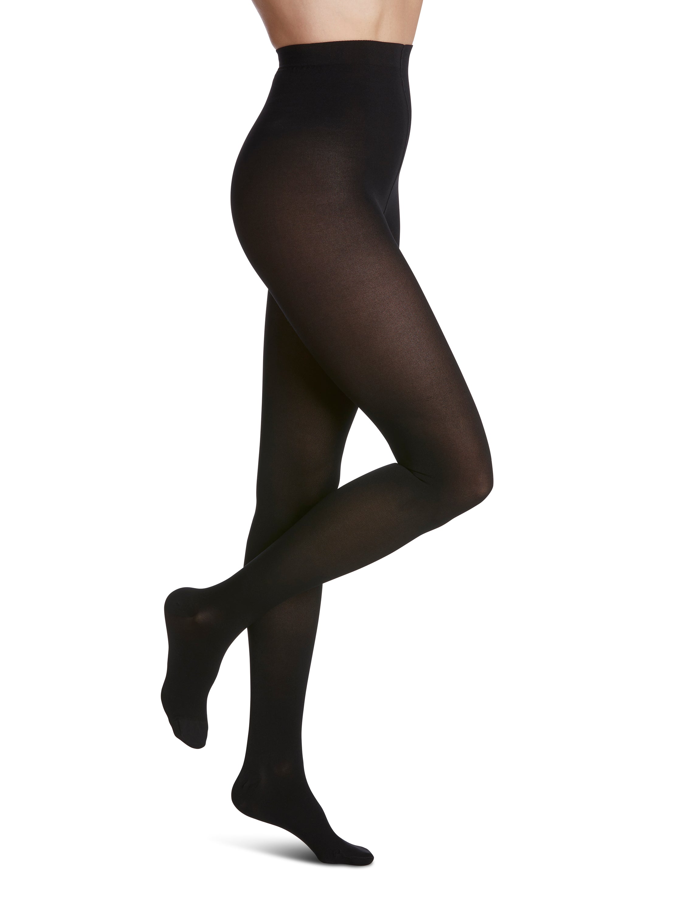 Woman wearing Sigvaris Essential Opaque compression pantyhose in the color Black