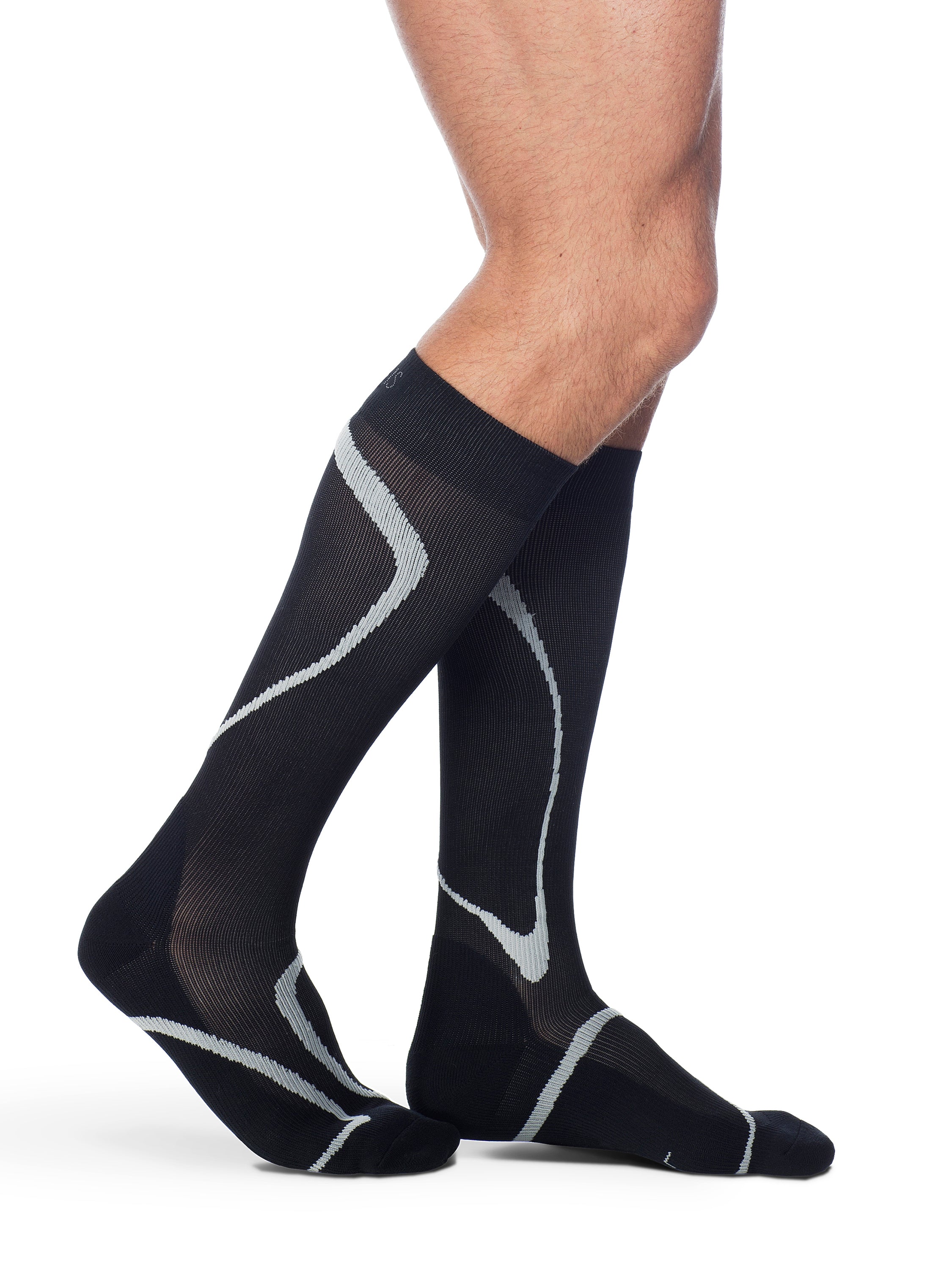 Man wearing Sigvaris Motion High Tech compression socks in the color Black