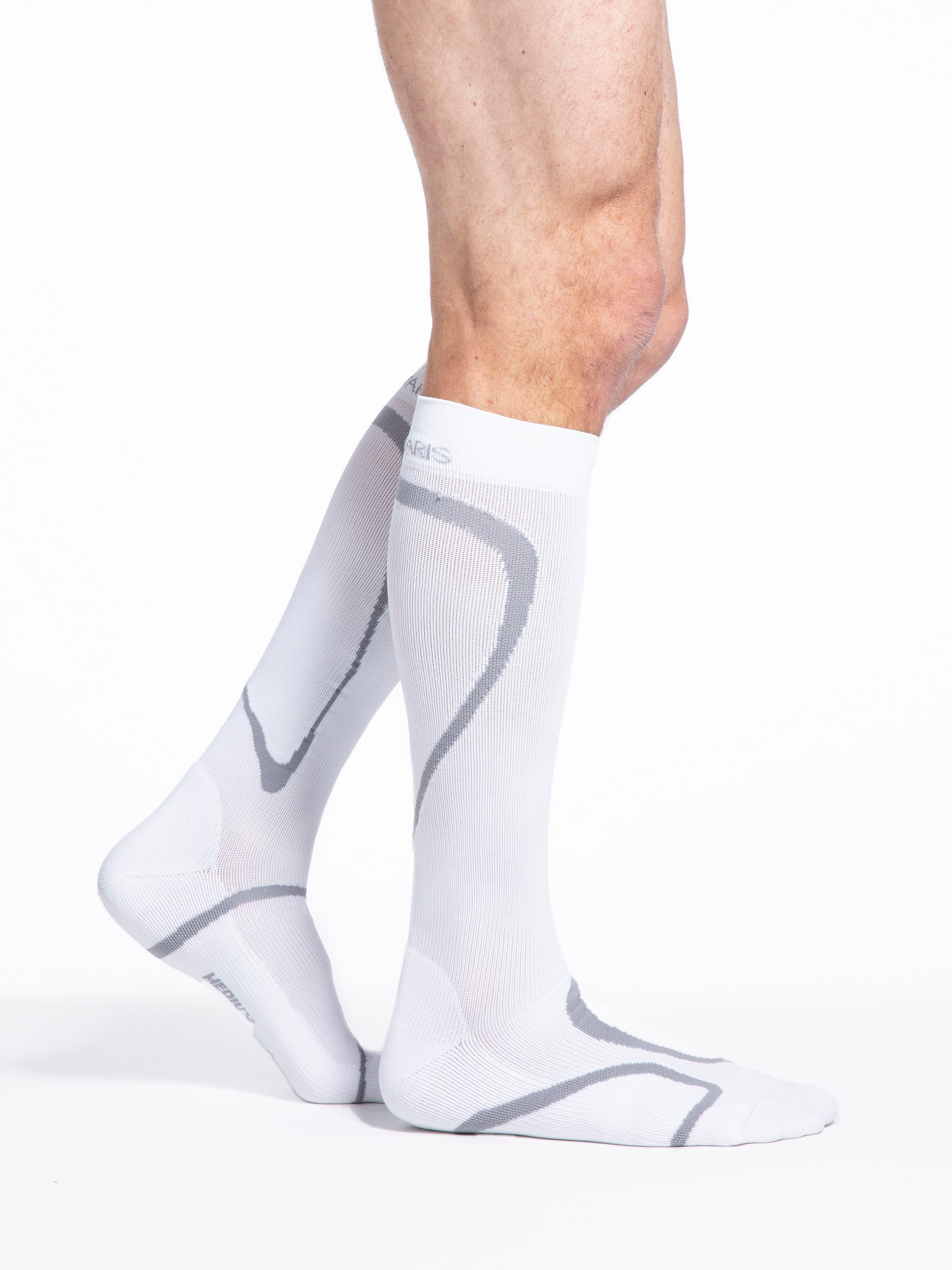 Man wearing Sigvaris Motion High Tech compression socks in the color White